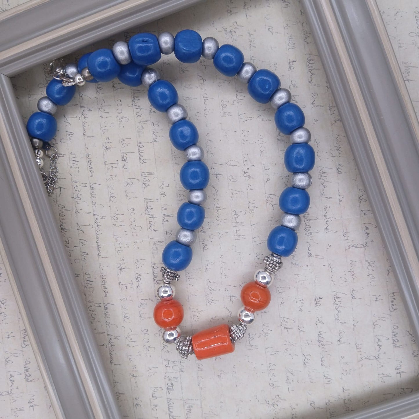 Orange ceramic, hematite and wood Choker